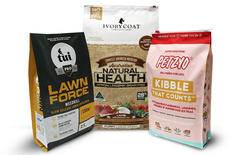 Three stand-up pouches including dog food brands Petzyo, Ivory Coat, and Tui lawn fertilizer.