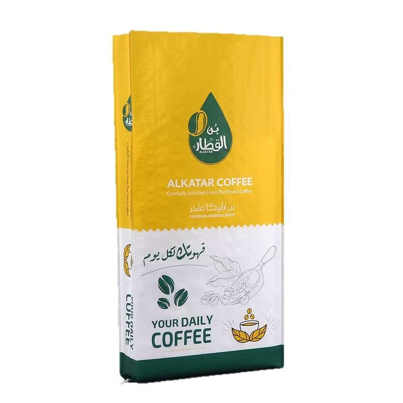 Custom printed coffee packaging bag with Arabic and English text, featuring yellow and white design and coffee graphics.