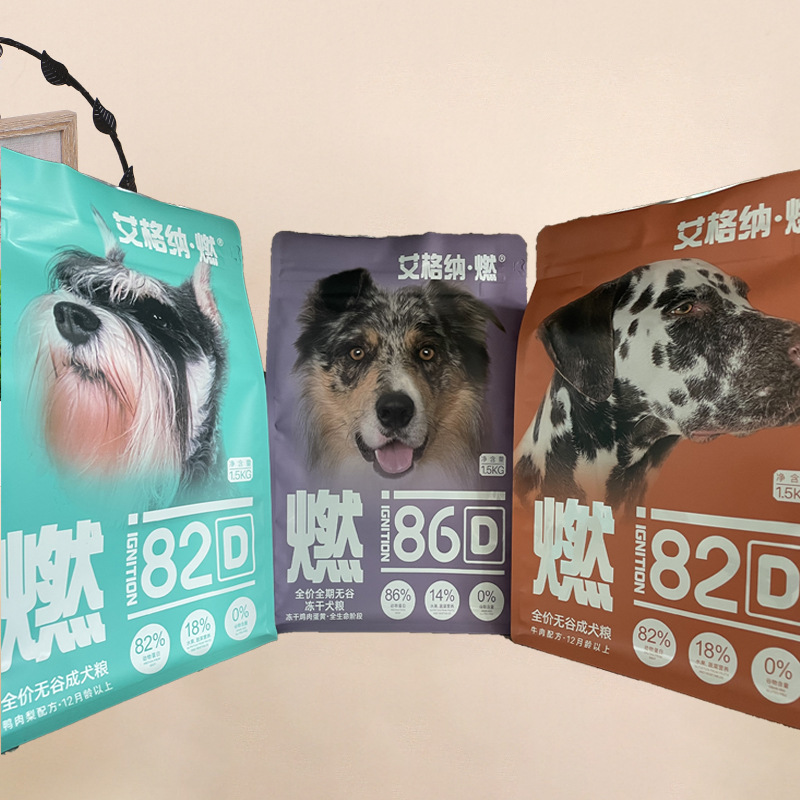 Three colorful dog food stand-up pouches with realistic dog photos and bold text.