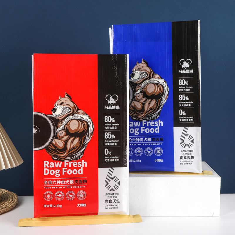 Boldly designed red and blue pet food packaging with muscular dog graphic and protein content labels.