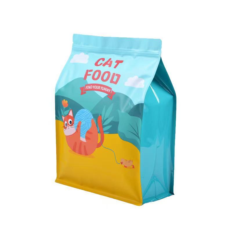 Colorful flat bottom cat food bag with playful cartoon cat and yarn illustration.