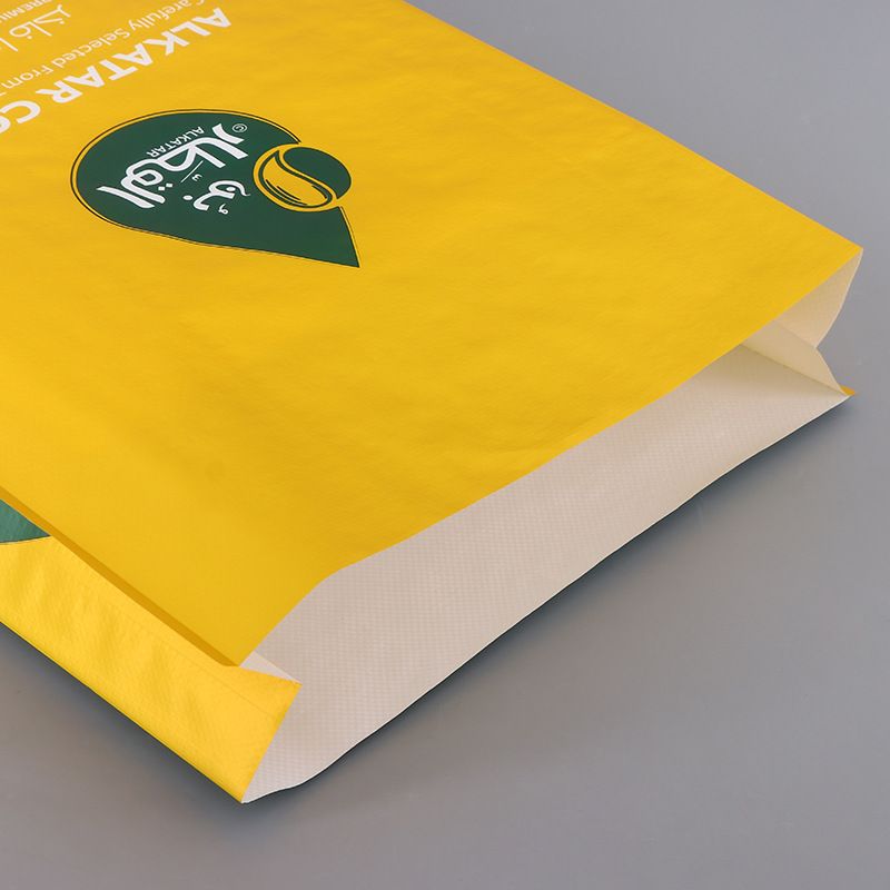 Close-up of yellow coffee packaging bag with side gusset and matte surface finish.