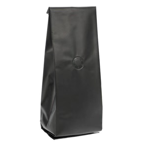 Side gusset matte black coffee bag with degassing valve, plain design.