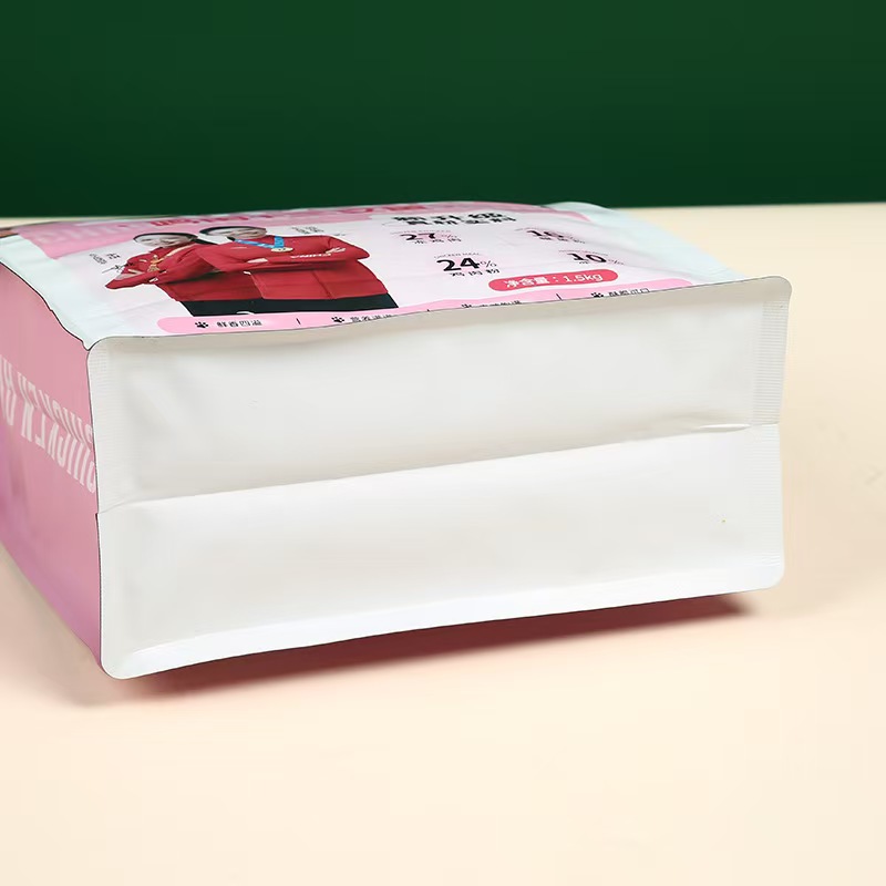 Bottom view of pink and white pet food pouch with gusset design.