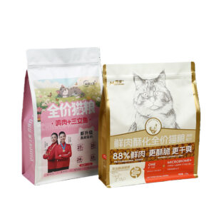 Two colorful cat food packaging bags with Chinese branding and cartoon cat designs.