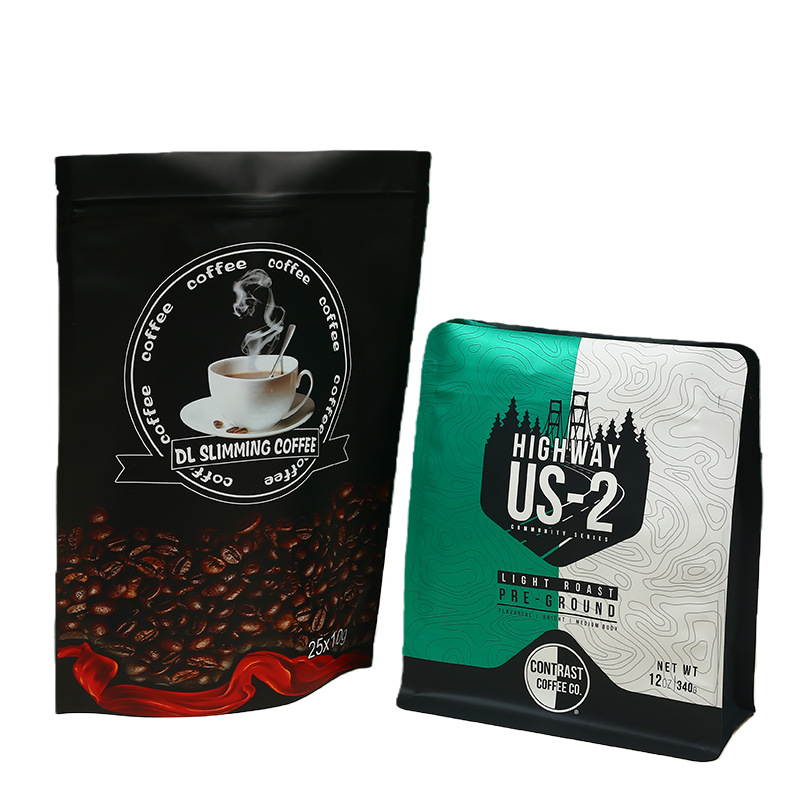 Two printed coffee bags featuring DL Slimming Coffee and Highway US-2 light roast pre-ground.