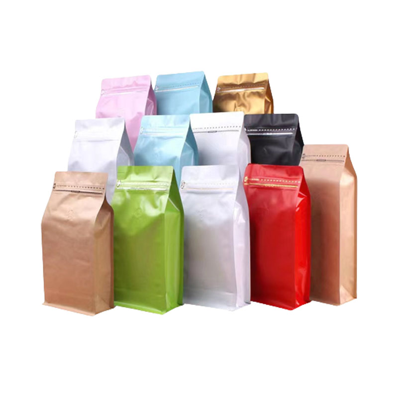 Multi-colored flat bottom pouches with zipper seal, suitable for coffee and food packaging.