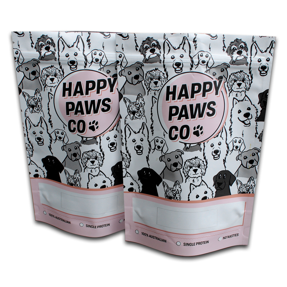 Two dog food packaging bags with cartoon dog illustrations and pink branding.