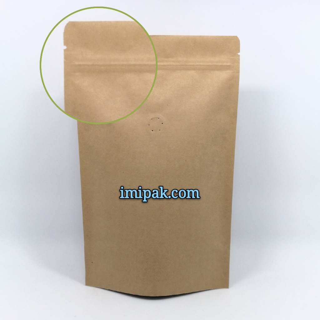 Kraft stand up pouch with zipper and one-way degassing valve for coffee packaging.