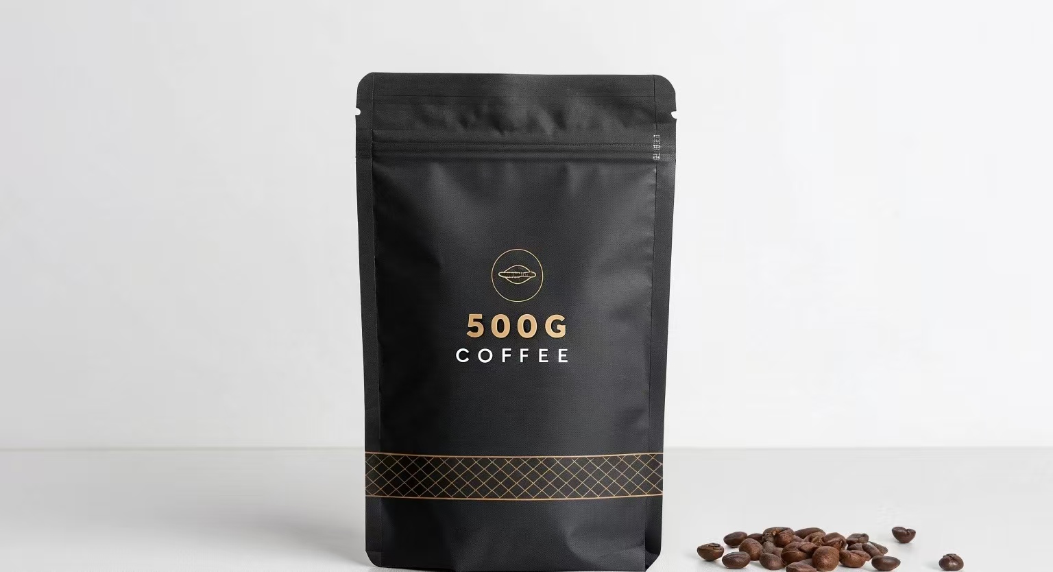 Matte black coffee pouch labeled 500G with golden design, next to roasted coffee beans.