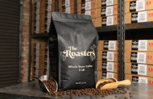 Black 5 lb coffee bag with valve in warehouse setting