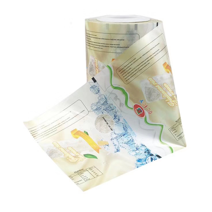 Custom printed transparent laminated roll film for frozen food packaging applications