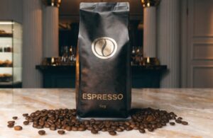 Black espresso coffee packaging pouch with roasted coffee beans display.